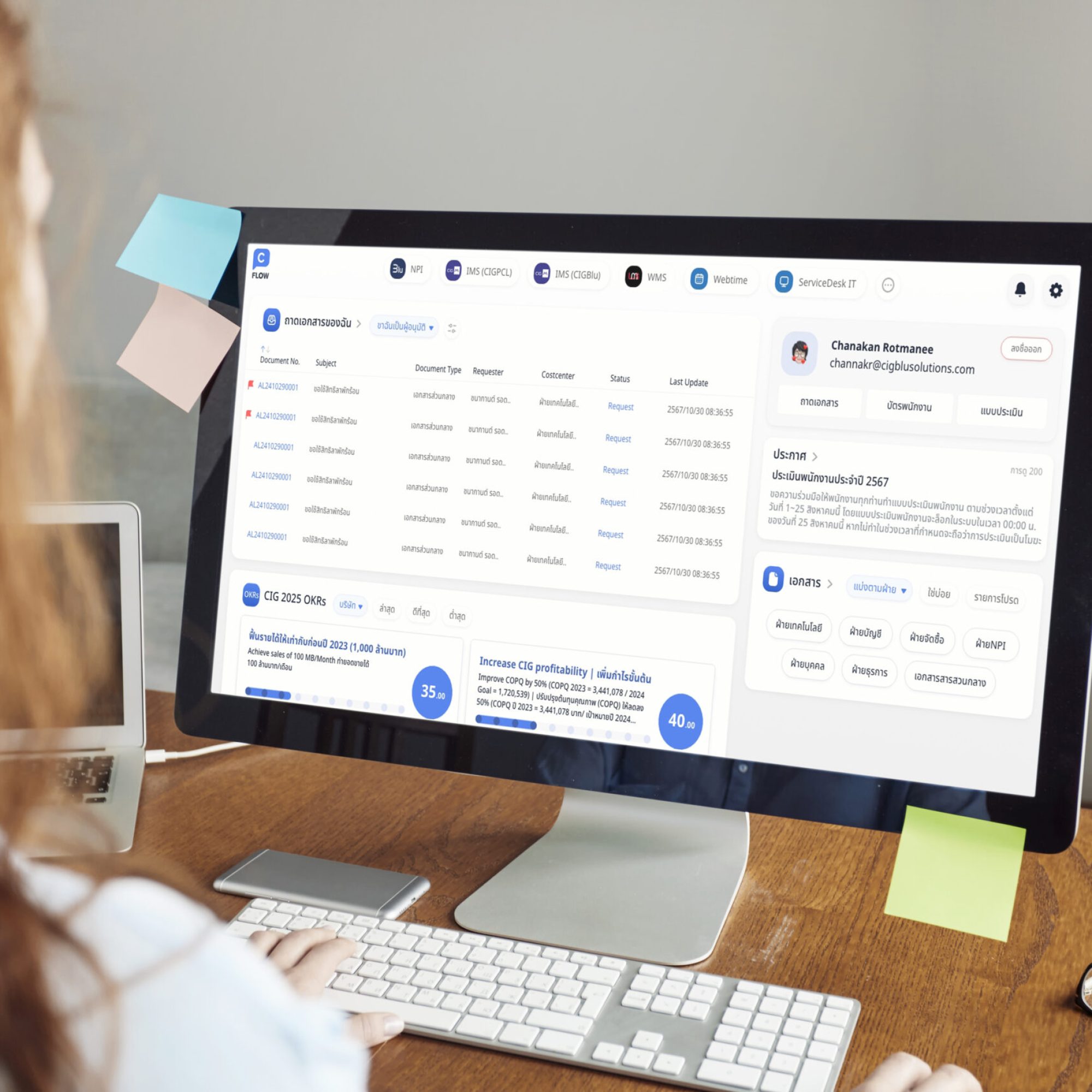 cropped-rear-portrait-young-student-with-red-hair-wearing-blue-shirt-typing-pc